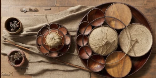 wooden spool,copper cookware,wooden buckets,wooden wheel,patterned wood decoration,wooden cable reel,wooden bowl,wooden balls,wooden plate,leather compartments,wooden rings,basket maker,antique singing bowls,wooden drum,dish storage,singing bowls,decorative fan,plate shelf,bowl of chestnuts,wine barrel