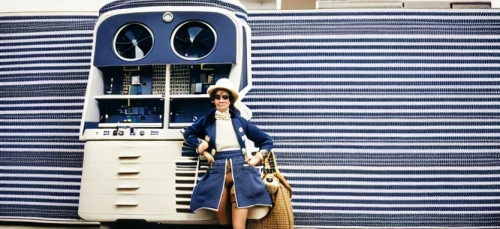 audrey hepburn-hollywood,laundress,telephone booth,blue pushcart,water dispenser,pay phone,water cooler,blue and white porcelain,phone booth,stewardess,laundromat,vending cart,audrey hepburn,shopping icon,portable toilet,vintage fashion,clothes dryer,laundry shop,shopper,luggage compartments