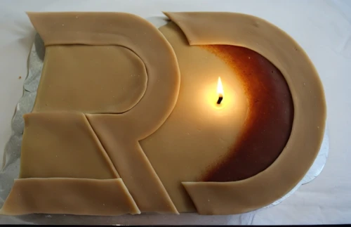 letter r,r,reibekuchen,baumkuchen,gelatin dessert,creme caramel,birthday candle,dulce de leche,royal icing,chocolate letter,a cake,a candle,eieerkuchen,wax candle,beeswax candle,boston cream pie,flameless candle,rss icon,torta,turrón
