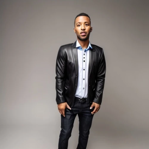 television presenter,african american male,male model,men's wear,men clothes,beatenberg,portrait background,kendrick lamar,black male,a black man on a suit,bolero jacket,novelist,leather jacket,social,studio photo,south african,young man,jeans background,martial,young model