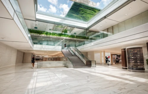 costanera center,shopping mall,the dubai mall entrance,landscape designers sydney,glass facade,central park mall,glass wall,lobby,landscape design sydney,glass building,daylighting,entrance hall,danube centre,glass tiles,multistoreyed,structural glass,glass roof,escalator,entry path,hallway space