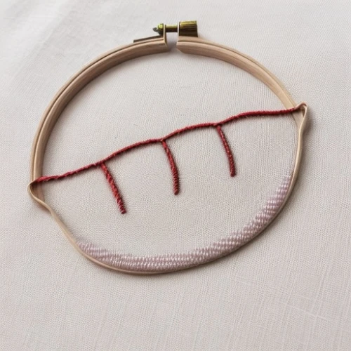 cross-stitch,embroider,embroidery,stitched heart,stitching,needlework,embroidered,trees with stitching,tennis racket accessory,macrame,vintage embroidery,hoop (rhythmic gymnastics),stitched,sewing stitches,cordage,curved ribbon,to knit,circle shape frame,pipe cleaner,wampum snake