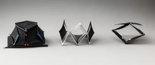 folding table,paper stand,first order tie fighter,napkin holder,knife block,suit of spades,delta-wing,origami,geometric solids,diving fins,desk accessories,collection of ties,folding,swiss army knives,black cut glass,cube surface,steel sculpture,triangle ruler,tie-fighter,cube stilt houses,Architecture,General,Masterpiece,Humanitarian Modernism