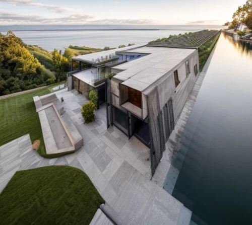 house by the water,dunes house,house with lake,modern architecture,landscape design sydney,water wall,exposed concrete,landscape designers sydney,mirror house,modern house,lago grey,luxury property,contemporary,lake view,cube house,infinity swimming pool,archidaily,lake taupo,corten steel,pool house,Architecture,General,Modern,Organic Modernism 1