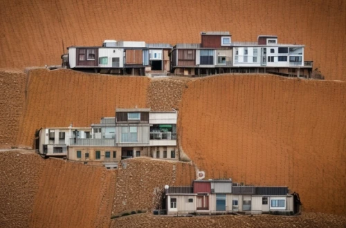 icelandic houses,grain harvest,row of houses,eco-construction,soil erosion,desertification,houses,rural,agriculture,housebuilding,excavation,nebraska,agricultural,dunes house,potato field,serial houses,erosion,rural style,lonely house,agroculture
