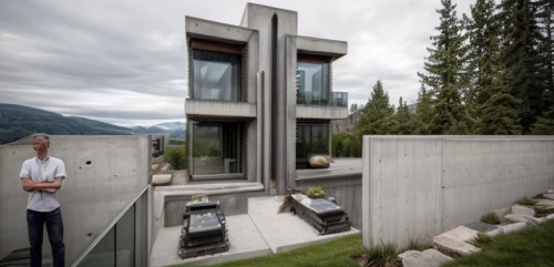 cubic house,exposed concrete,modern house,modern architecture,cube stilt houses,mirror house,concrete construction,concrete grinder,cube house,concrete blocks,house in the mountains,house in mountains,metal cladding,concrete slabs,syringe house,dunes house,residential house,inverted cottage,corten steel,house with lake,Architecture,General,Modern,Elemental Architecture