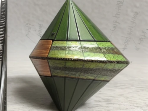 glass pyramid,cube surface,triangular,green folded paper,triangle ruler,faceted diamond,pyramid,russian pyramid,prism ball,mandarin wedge,geometric solids,triangular clover,prism,3d object,pencil sharpener,beautiful pencil,rubics cube,mobile sundial,wooden pencils,pythagoras