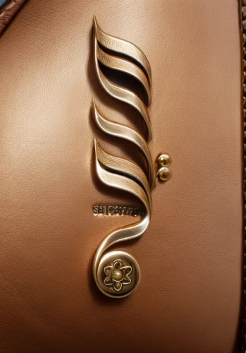 belt buckle,leather compartments,leather suitcase,leather texture,embossed,leather goods,abstract gold embossed,handbag,buckle,carabiner,purse,luxury accessories,embossed rosewood,monogram,sinuous,purses,birkin bag,clasps,embossing,handbags,Realistic,Fashion,Classic And Equestrian