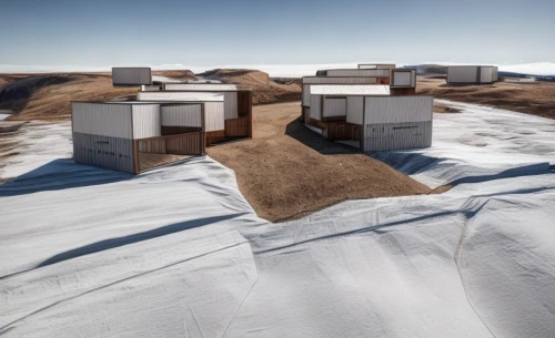 cube stilt houses,shipping containers,cargo containers,salt farming,solar cell base,stacked containers,floating production storage and offloading,south pole,floating huts,snow bales,moving dunes,salt extraction,solar batteries,saltworks,containers,saltpan,admer dune,human settlement,cube surface,desertification,Common,Common,Natural