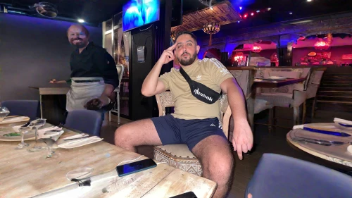 karaoke,serving,club chair,steakhouse,thriving,looking through legs,foodie,birthday template,party dad,long legs,skort,bar stools,fine dining,serve,in shorts,legs,sitting on a chair,espadrille,enjoy the meal,leg