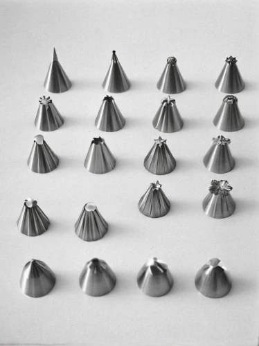 crown caps,shells,lampions,push pins,round metal shapes,conical hat,bullet shells,cones,witches' hats,in shells,thumbtack,chess pieces,arrowheads,vertical chess,turrets,teapots,bell-shaped,nozzles,ball fortune tellers,pickelhaube,Photography,Black and white photography,Black and White Photography 10