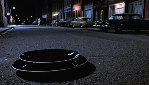 synthetic rubber,street furniture,manhole,saucer,hubcap,rubber tire,garbage cans,garbage can,black plates,curb,trash can,trashcan,outdoor street light,car tire,automotive parking light,streetlight,pot hole,trash cans,car tyres,hub cap,Art,Artistic Painting,Artistic Painting 22