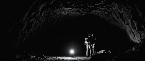 lava tube,mine shaft,caving,cave tour,speleothem,cave,mining,stalagmite,miner,pit cave,coal mining,catacombs,the limestone cave entrance,flashlight,hollow way,gold mining,tunnel,underworld,lava cave,a flashlight,Photography,Black and white photography,Black and White Photography 06