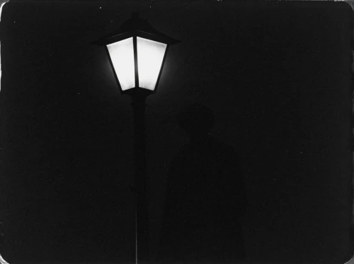 silhouette of man,streetlight,dark portrait,man silhouette,lubitel 2,streetlamp,street light,street lamp,light leak paper,darkroom,lichtgestalt,agfa isolette,outdoor street light,sillouette,enlarger,lamplighter,nightlight,lamppost,lantern,iron street lamp,Photography,Black and white photography,Black and White Photography 03