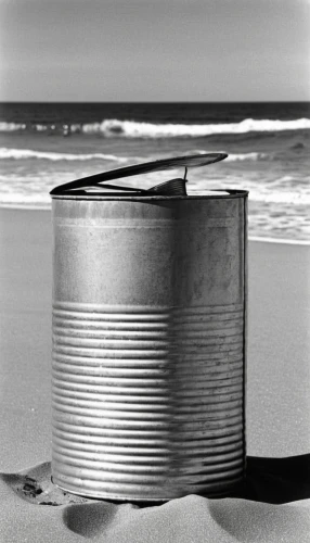 round tin can,wooden bucket,tin can,tin cans,automotive piston,sand bucket,life buoy,beach furniture,stainless steel,churning,wooden buckets,beachcombing,piston ring,round tin,barrel,beach defence,treasure chest,oil filter,wooden spool,tin,Photography,Black and white photography,Black and White Photography 14