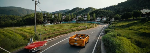 steep mountain pass,tuk tuk,subaru 360,hindustan ambassador,tata nano,piaggio ape,national highway,miniature cars,alpine drive,the pamir highway,2cv,fiat 850,renault trafic,fiat 600,citroen 2cv,mountain highway,tata sumo,car train,mountain pass,racing road