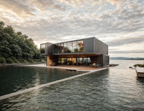house by the water,house with lake,houseboat,cube stilt houses,floating huts,cubic house,cube house,boat house,modern house,dunes house,house of the sea,boathouse,modern architecture,inverted cottage,swiss house,floating island,floating over lake,corten steel,luxury property,floating on the river,Architecture,General,Modern,Elemental Architecture