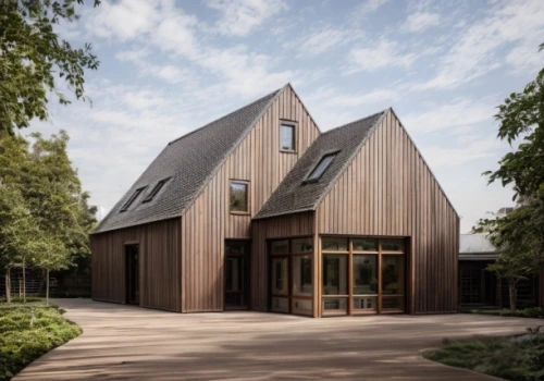 timber house,frisian house,danish house,house hevelius,wooden house,forest chapel,wooden church,archidaily,exzenterhaus,dunes house,residential house,metal cladding,frame house,slate roof,clay house,kirrarchitecture,folding roof,wooden construction,wooden facade,chilehaus