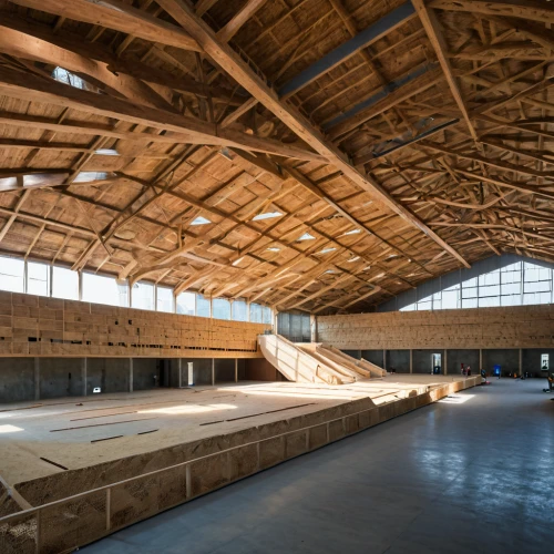 skating rink,wooden beams,horse barn,hangar,equestrian center,saltworks,archidaily,barn,roof truss,factory hall,field house,wooden roof,performance hall,daylighting,loft,quilt barn,industrial hall,ski facility,roof structures,wooden construction,Photography,General,Natural