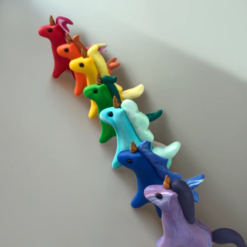 ponies,animal balloons,play figures,horse herd,kangaroo mob,clay figures,whimsical animals,equines,plasticine,many teat mice,herd of goats,hippocampus,miniature figures,paper chain,antelopes,figurines,paper snakes,unicorns,clay animation,clothe pegs