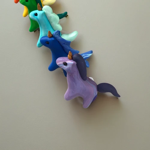 pacifier tree,starfishes,coat hooks,plasticine,clothe pegs,advent decoration,sea creatures,origami paper,bird toy,hippocampus,whimsical animals,christmas tree decorations,bronze hammerhead shark,wall decoration,paper scrapbook clamps,origami,hanging decoration,hanging elves,wind chime,dog toys