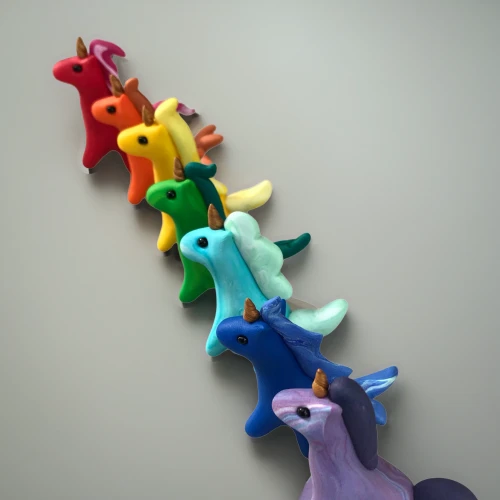 paper scrapbook clamps,ponies,clothe pegs,animal balloons,rainbow tags,paper chain,scrapbook clamps,wooden toys,stuff toy,toy airplane,coat hooks,paper snakes,horse herd,pinwheels,equines,rainbow jazz silhouettes,whimsical animals,motor skills toy,children toys,hippocampus