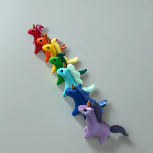 rainbow jazz silhouettes,clothe pegs,paper chain,plasticine,animal balloons,play figures,felt tip pens,ponies,paper scrapbook clamps,paper snakes,dog toys,hippocampus,motor skills toy,stuff toy,game pieces,plastic toy,children toys,rainbow tags,color dogs,meeple