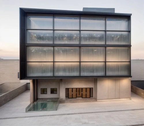 glass facade,dunes house,cubic house,glass facades,modern architecture,structural glass,cube house,frame house,glass building,modern house,mirror house,archidaily,residential house,metal cladding,glass wall,contemporary,glass panes,modern building,window film,glass blocks,Architecture,Commercial Building,Modern,Geometric Harmony