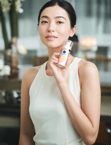 woman holding a smartphone,glucose meter,alipay,wireless tens unit,micro sim,women's cosmetics,oil cosmetic,dermatologist,pocari sweat,natural cosmetic,face cream,mobile phone battery,cosmetic products,huawei,skincare,asian woman,feature phone,perfume bottle,medicine icon,face care