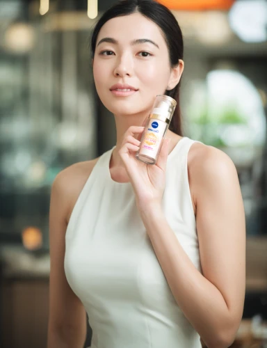 woman holding a smartphone,glucose meter,alipay,wireless tens unit,pocari sweat,e-cigarette,micro sim,women's cosmetics,medical thermometer,perfume bottle,e-wallet,mobile phone battery,asian woman,pulse oximeter,bluetooth headset,woman with ice-cream,lip balm,japanese woman,mobile payment,voice search