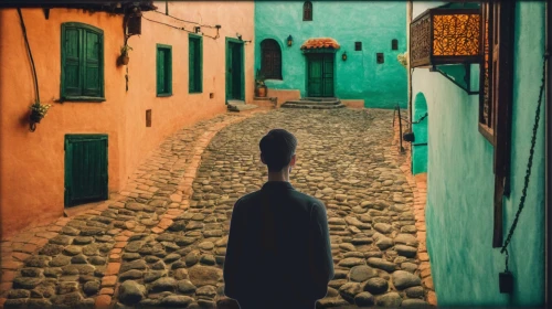 narrow street,woman walking,girl walking away,alley,marrakesh,marrakech,morocco,the cobbled streets,passage,morocco lanterns,puglia,man with umbrella,alleyway,walking man,pedestrian,riad,old linden alley,middle eastern monk,a pedestrian,cobble
