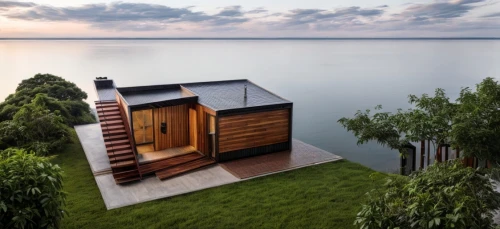 house by the water,floating huts,house with lake,inverted cottage,landscape design sydney,wooden sauna,cube stilt houses,summer house,landscape designers sydney,lake victoria,wooden decking,small cabin,lake view,cubic house,stilt house,corten steel,dunes house,summer cottage,lake balaton,wooden house,Architecture,Villa Residence,Masterpiece,Vernacular Modernism