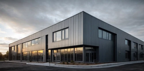 metal cladding,prefabricated buildings,glass facade,new building,industrial building,cubic house,modern building,office building,assay office,cube house,modern architecture,frame house,steel construction,glass building,archidaily,office buildings,kettunen center,structural glass,school design,kirrarchitecture