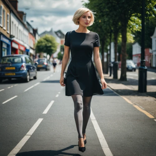 black dress with a slit,pencil skirt,woman walking,wallis day,on the street,fashion street,black skirt,dress walk black,black dress,blonde woman,women fashion,menswear for women,woman in menswear,in a black dress,sheath dress,retro woman,girl walking away,latex clothing,pixie-bob,little black dress,Photography,Documentary Photography,Documentary Photography 08