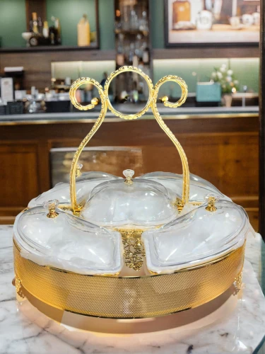 cake stand,orrery,chafing dish,champagne cocktail,spa water fountain,tureen,quartz clock,punch bowl,fragrance teapot,serving tray,vintage dishes,salt bar,floor fountain,apple champagne cake,soap dish,champagne flute,tea service,butter dish,dessert station,bathtub accessory,Small Objects,Indoor,Hipster Coffee