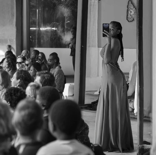 girl in a long dress from the back,girl in a long dress,woman holding a smartphone,long dress,wedding photographer,girl from the back,a girl with a camera,paparazzi,taking photos,paparazzo,public show,photographing,fashion show,girl from behind,taking photo,strapless dress,girl in white dress,elegant,wedding photo,jazz singer
