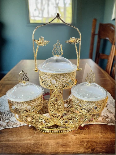 vintage dishes,candlestick for three candles,tablescape,persian new year's table,vintage china,tea service,dinnerware set,tea set,gold chalice,table setting,japanese pattern tea set,eucharistic,golden candlestick,place setting,cake stand,persian norooz,tea party collection,vintage tea cup,dining table,wedding glasses