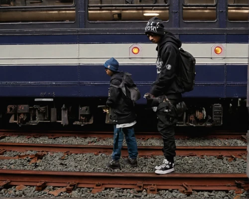 migrants,french train station,model train figure,refugee,tiny people,train station,manneken pis,pedestrians,man and boy,metro,the girl at the station,the train station,the train,migratory,traveller,to scale,refugees,metro station,photographing children,train platform,Conceptual Art,Graffiti Art,Graffiti Art 12