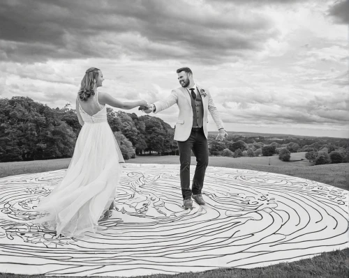 chalk drawing,chalk outline,dance with canvases,swirl,sundial,sun dial,whirling,wind wave,swirling,wedding photo,chalk traces,sand art,kinetic art,wind direction,conceptual photography,drawing with light,silver wedding,mobile sundial,wedding photography,fusion photography,Illustration,Black and White,Black and White 05