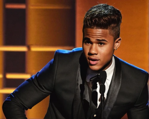 justin bieber,a black man on a suit,banner,playback,mohawk hairstyle,muffin,the suit,orator,award background,navy suit,music artist,wireless microphone,lifesaver,prince,black businessman,golden haired,black suit,red tie,brown chocolate,believer,Art,Classical Oil Painting,Classical Oil Painting 31
