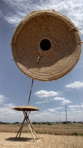 straw cart,chair in field,straw hat,round bale,hay barrel,field drum,mexican hat,grain field panorama,solar dish,hanging chair,basket weaver,straw carts,agroculture,sombrero,hat stand,straw bale,ordinary sun hat,round straw bales,straw hats,high sun hat