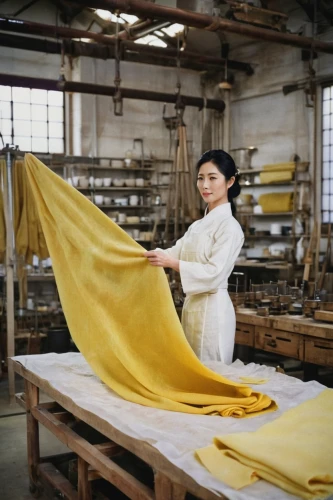raw silk,kimono fabric,sewing factory,woven fabric,yellow jumpsuit,female worker,handmade paper,hat manufacture,rolls of fabric,linen,girl with cloth,denim fabric,fabric,rice paper,girl in cloth,manufacture,dry cleaning,garment,fabric design,seamstress,Photography,Fashion Photography,Fashion Photography 04