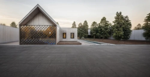 metal roof,forest chapel,metal cladding,cubic house,timber house,archidaily,corten steel,the threshold of the house,frame house,modern house,pilgrimage chapel,cube house,paved square,mirror house,wooden house,modern architecture,inverted cottage,roof landscape,residential house,glass facade