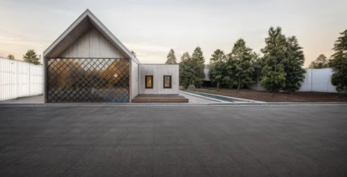 metal roof,metal cladding,corten steel,cubic house,archidaily,paved square,timber house,mirror house,the threshold of the house,forest chapel,cube house,roof landscape,folding roof,frame house,modern house,prefabricated buildings,pilgrimage chapel,glass facade,modern architecture,residential house