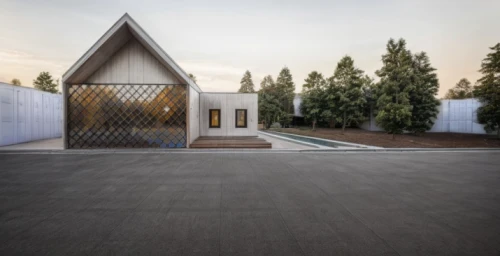 corten steel,metal cladding,cubic house,metal roof,forest chapel,archidaily,pilgrimage chapel,timber house,cube house,paved square,the threshold of the house,mirror house,build by mirza golam pir,prefabricated buildings,modern architecture,frame house,wooden church,modern house,wooden house,residential house
