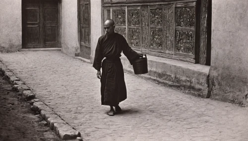 stieglitz,woman walking,middle eastern monk,girl walking away,woman hanging clothes,girl in a long dress,praying woman,abaya,woman praying,old linden alley,woman playing,girl in a long dress from the back,narrow street,woman holding gun,orlova chuka,hesse,girl with cloth,woman holding a smartphone,buddhist monk,luo han guo,Photography,Black and white photography,Black and White Photography 15