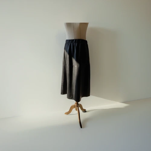 overskirt,dress walk black,black skirt,skirt,hoopskirt,women's clothing,pencil skirt,school skirt,garment,women clothes,tulle,clotheshorse,raw silk,one-piece garment,menswear for women,sheath dress,dress form,cocktail dress,shopwindow,ladies clothes