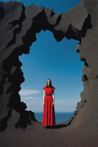 red cape,bjork,girl on the dune,man in red dress,lava cave,lava,lanzarote,yogananda,the tropic of cancer,album cover,national park los flamenco,grancanaria,the grave in the earth,secret garden of venus,gran canaria,aphrodite's rock,woman at the well,lady in red,sea cave,cd cover,Conceptual Art,Sci-Fi,Sci-Fi 18
