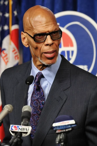 chuck,a black man on a suit,kareem,head coach,cubs,sports center for the elderly,afro-american,nba,rudy,afroamerican,neanderthal,afro american,norris,red auerbach,american football coach,american baseball player,black businessman,african american male,clyde puffer,yogi,Photography,Fashion Photography,Fashion Photography 02