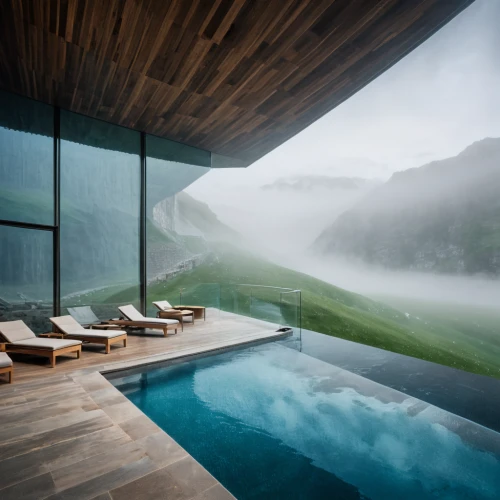 infinity swimming pool,house in mountains,house in the mountains,foggy landscape,pool house,water mist,the cabin in the mountains,luxury bathroom,outdoor pool,alpine style,luxury property,morning mist,chalet,foggy mountain,swiss house,mountain huts,roof landscape,luxury hotel,beautiful home,dug-out pool,Photography,General,Natural